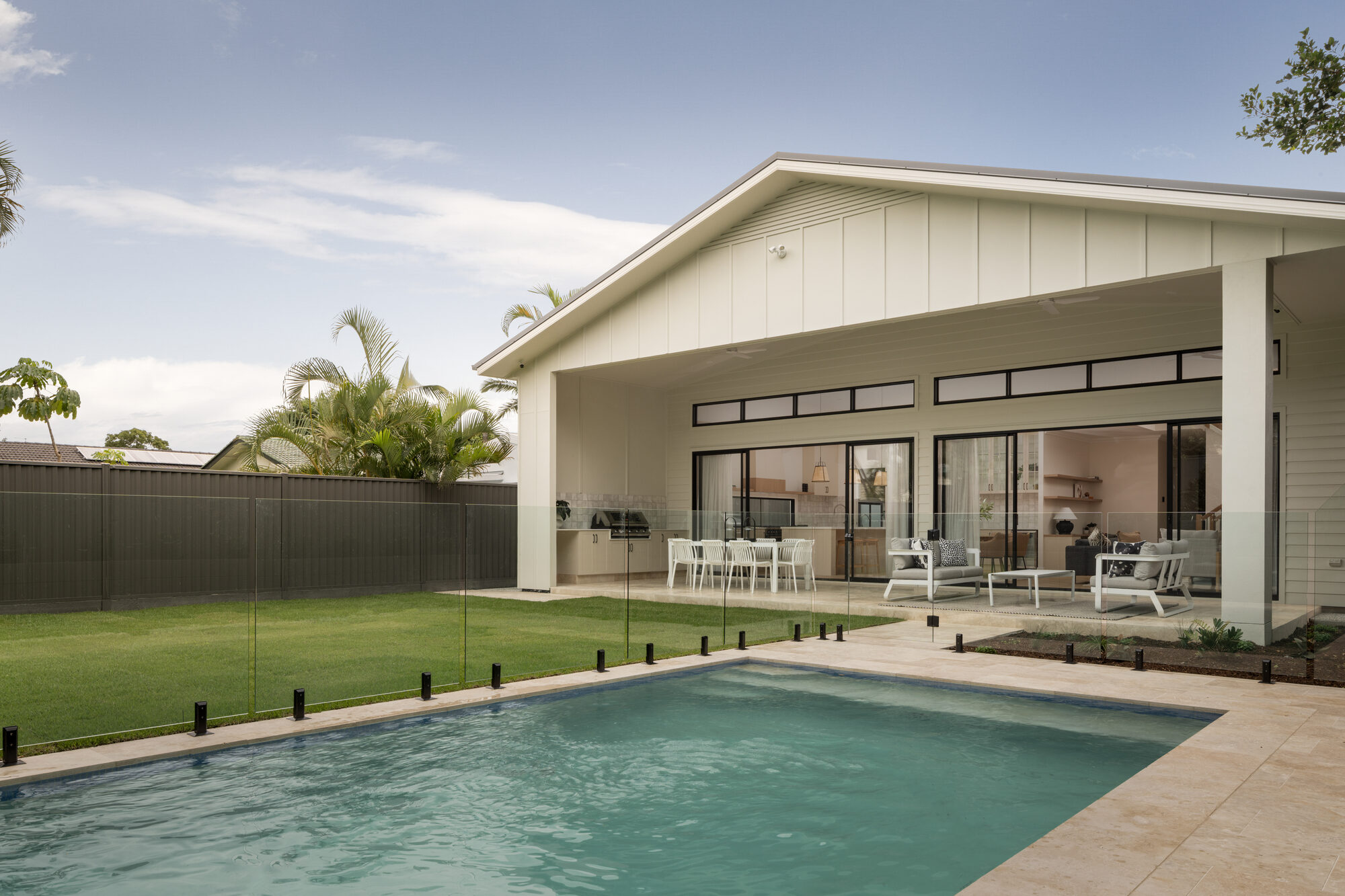 Backyard pool and covered alfresco at a single-storey new build home, Brisbane